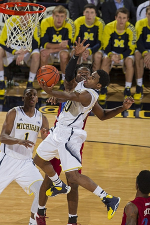 Glenn Robinson III (1) and Derrick Walton Jr. (10)