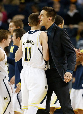 Spike Albrecht (2), Nik Stauskas (11), and Mitch McGary (4)