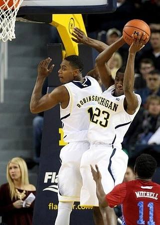 Glenn Robinson III (1) and Caris LeVert (23)