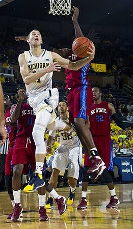 Nik Stauskas (11) and Jordan Morgan (52)