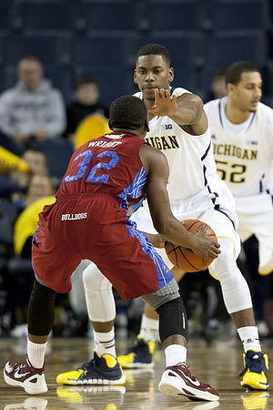 Glenn Robinson III (1) and Jordan Morgan (52)