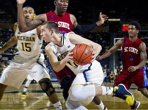 Jon Horford (15) and Nik Stauskas (11)