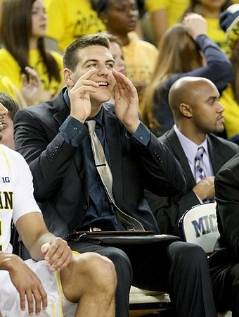 Mitch McGary (4) and C.J. Lee
