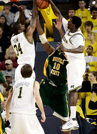 DeShawn Sims (34), Stu Douglass (1), and Manny Harris (3)
