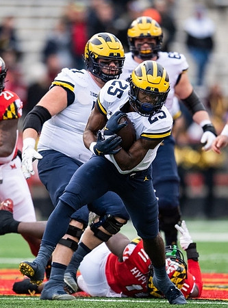 Hassan Haskins (25), Andrew Stueber (71), and Zak Zinter (65)