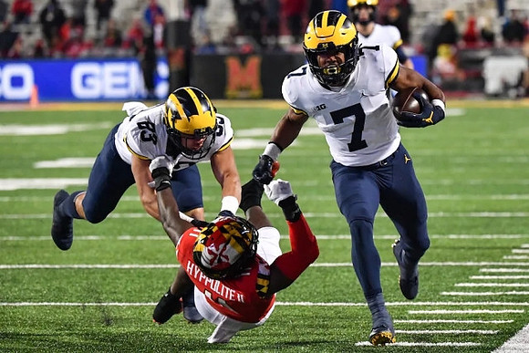 Erick All (83) and Donovan Edwards (7)