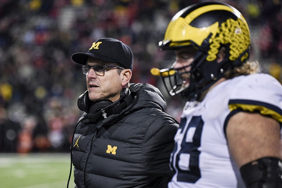 Jim Harbaugh and Andrew Vastardis (68)