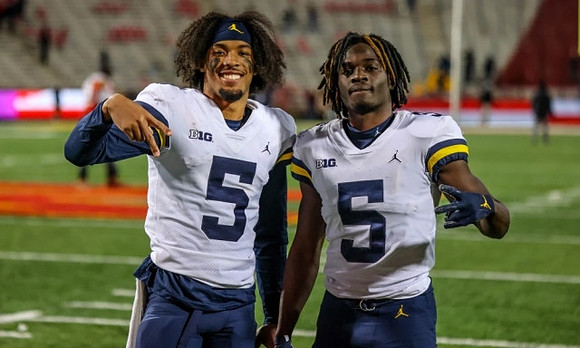 DJ Turner (5) and Mike Sainristil (5)