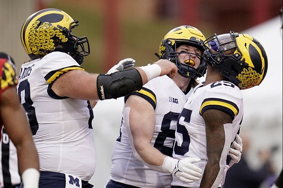 Andrew Vastardis (68), Luke Schoonmaker (86), and Hassan Haskins (25)