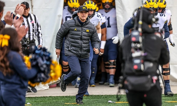 Jim Harbaugh and Aidan Hutchinson (97)