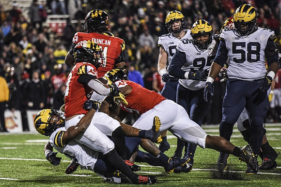 Aidan Hutchinson (97), Donovan Jeter (95), and Mazi Smith (58)