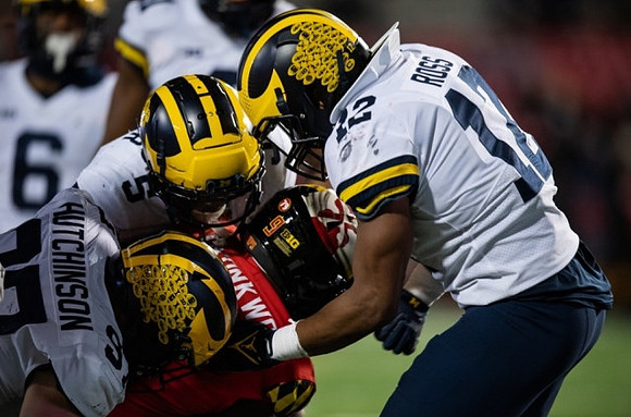 Aidan Hutchinson (97), DJ Turner (5), and Josh Ross (12)