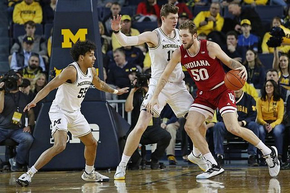 Eli Brooks (55) and Jon Teske (15)