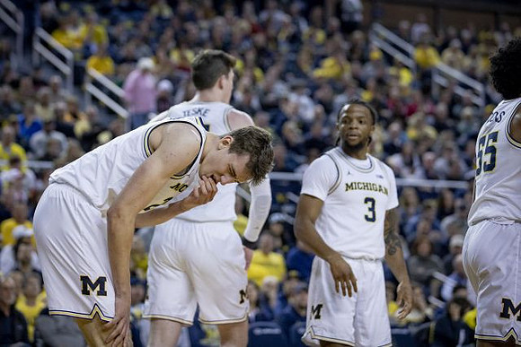 Franz Wagner (21), Jon Teske (15), Zavier Simpson (3), and Eli Brooks (55)
