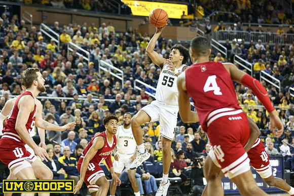 Eli Brooks (55) and Zavier Simpson (3)