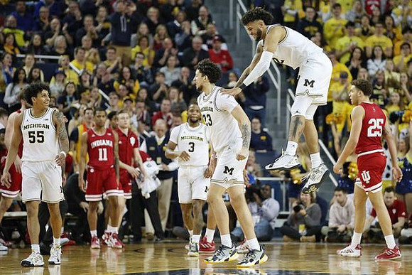 Eli Brooks (55), Zavier Simpson (3), Brandon Johns Jr. (23), and Isaiah Livers (2)