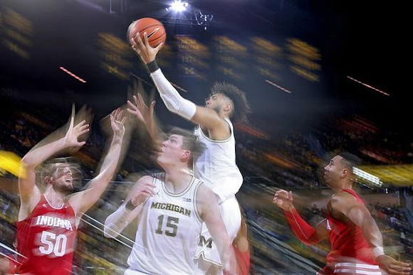 Jon Teske (15) and Isaiah Livers (2)