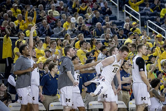 Rico Ozuna-Harrison (14), Brandon Johns Jr. (23), Luke Wilson (32), Eli Brooks (55), Jon Teske (15), Austin Davis (51), and Isaiah Livers (2)