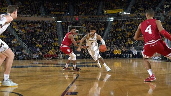 Jon Teske (15) and Isaiah Livers (2)