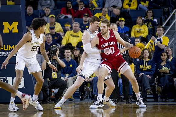 Eli Brooks (55) and Jon Teske (15)