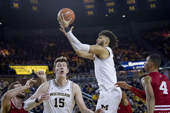 Jon Teske (15) and Isaiah Livers (2)