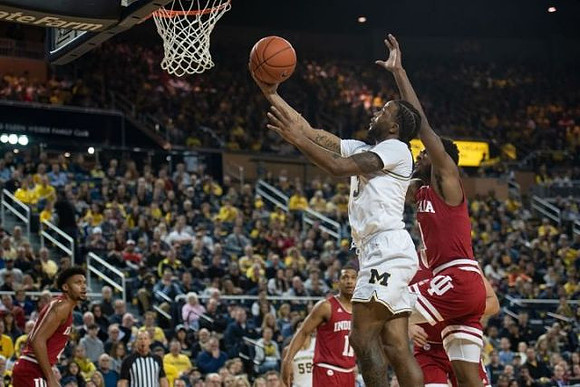 Zavier Simpson (3) and Eli Brooks (55)