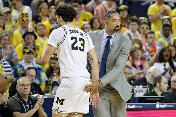 Brandon Johns Jr. (23) and Juwan Howard