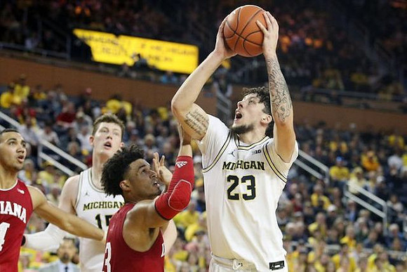 Jon Teske (15) and Brandon Johns Jr. (23)
