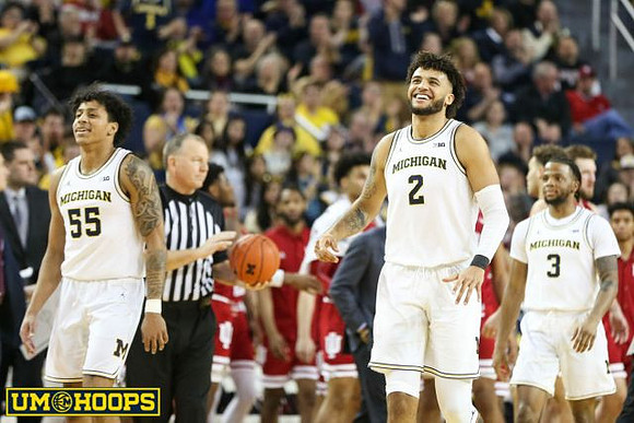 Eli Brooks (55), Isaiah Livers (2), and Zavier Simpson (3)