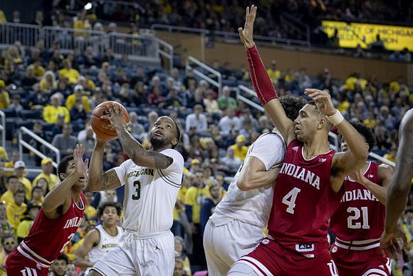Zavier Simpson (3), Eli Brooks (55), and Brandon Johns Jr. (23)