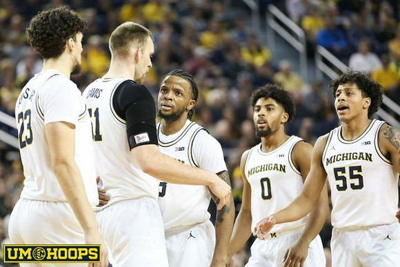 Brandon Johns Jr. (23), Austin Davis (51), Zavier Simpson (3), David DeJulius (0), and Eli Brooks (55)
