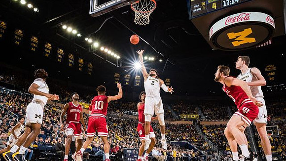 Eli Brooks (55), Zavier Simpson (3), Isaiah Livers (2), and Jon Teske (15)