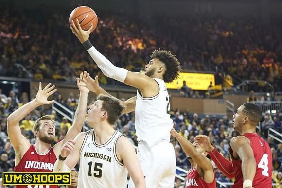 Jon Teske (15) and Isaiah Livers (2)