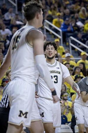 Jon Teske (15) and Brandon Johns Jr. (23)
