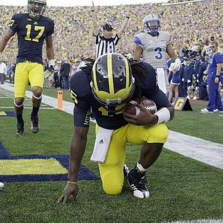 Denard Robinson (16) and Jeremy Jackson (17)