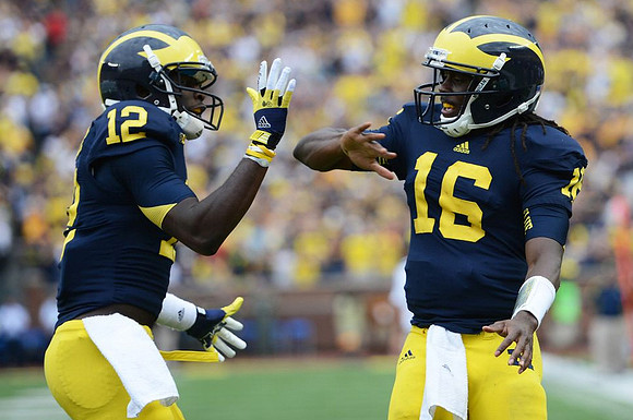 Devin Gardner (12) and Denard Robinson (16)