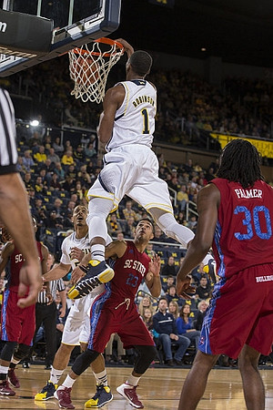 Glenn Robinson III (1) and Jordan Morgan (52)