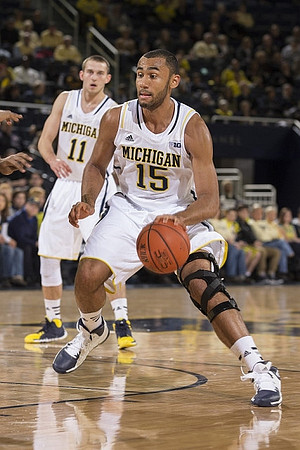 Nik Stauskas (11) and Jon Horford (15)