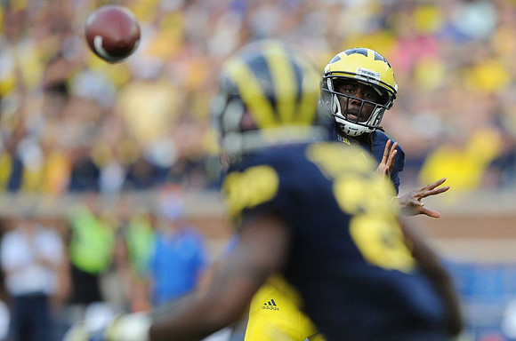 Denard Robinson (16) and Fitzgerald Toussaint (28)