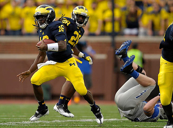 Denard Robinson (16) and Fitzgerald Toussaint (28)