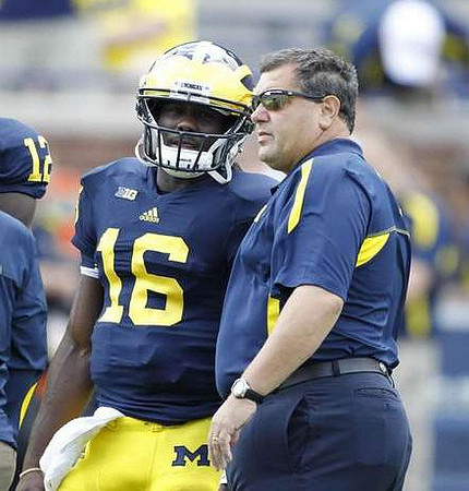 Denard Robinson (16) and Brady Hoke