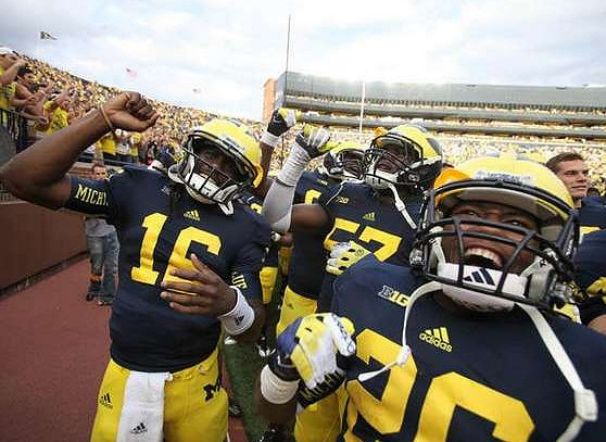 Denard Robinson (16), Frank Clark (57), and Dennis Norfleet (26)