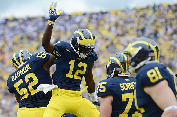 Ricky Barnum (52), Denard Robinson (16), Michael Schofield (75), and Mike Kwiatkowski (81)