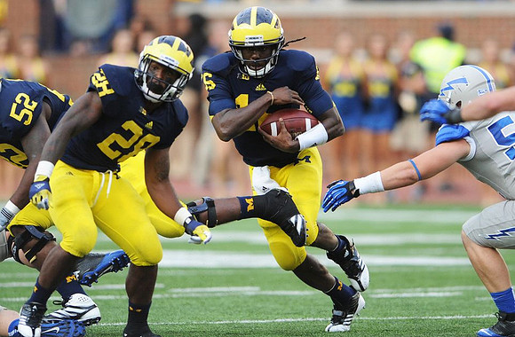 Ricky Barnum (52), Fitzgerald Toussaint (28), and Denard Robinson (16)