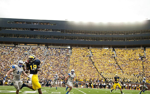 Devin Funchess (19) and Mike Kwiatkowski (81)