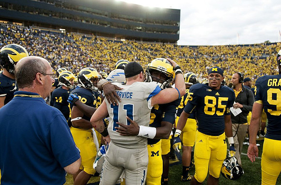 Denard Robinson (16) and Joe Reynolds (85)