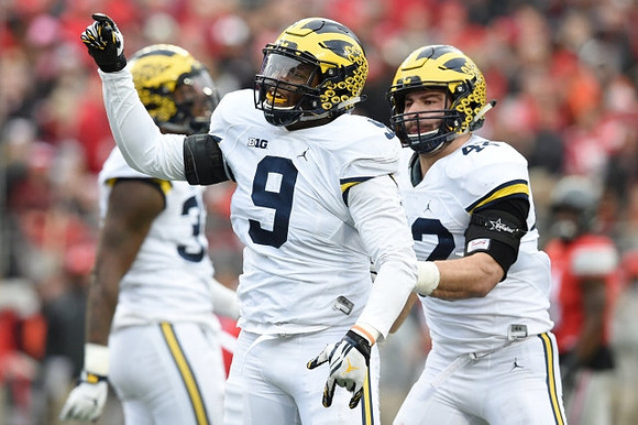 Taco Charlton (33), Mike McCray (9), and Ben Gedeon (42)