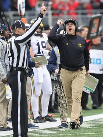 Tyrone Wheatley Sr., Henry Poggi (19), and Jim Harbaugh