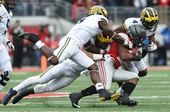 Mike McCray (9), Jabrill Peppers (5), and Delano Hill (44)