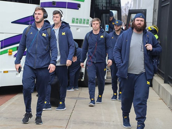 Jake Butt (88), Wilton Speight (3), Erik Magnuson (78), and Michigan Team